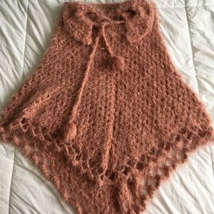 A blush color wool ponchos.